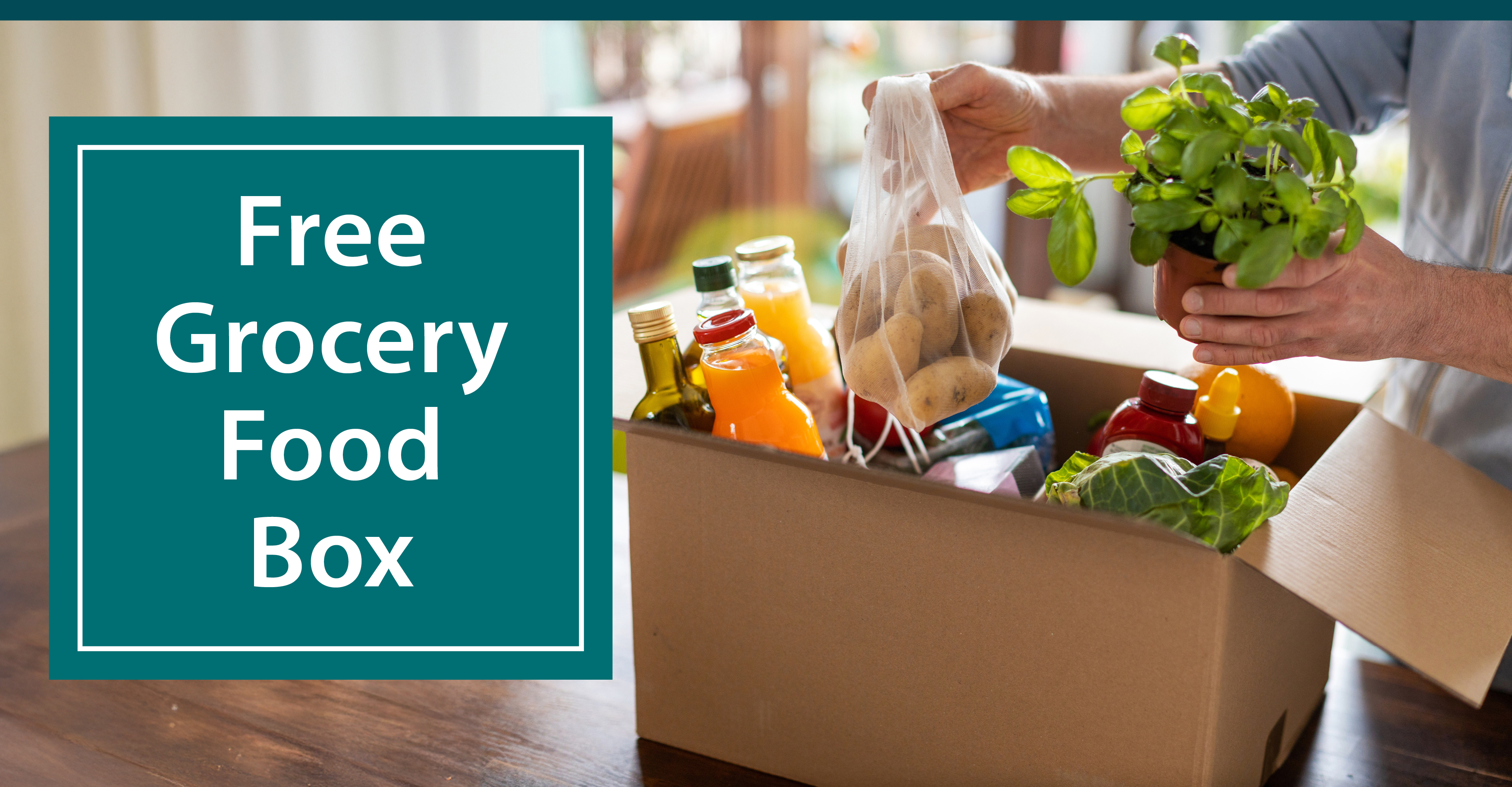 Free Grocery Food Box - a person pulling food out of a brown box