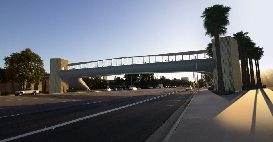 White bridge spanning a street 