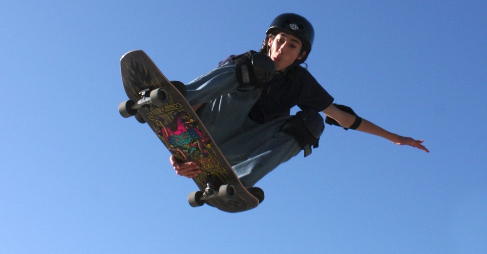 skateboarder doing a trick in the air